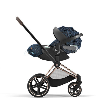 Stroller with dark blue pattern and black frame, side view.
