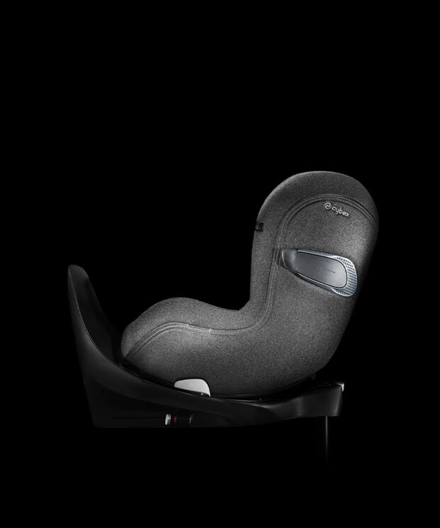 A grey Cybex car seat, side view on a black background.