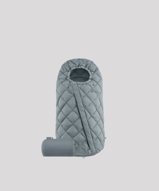 A grey quilted sleeping bag with a matching pillow on a white background.