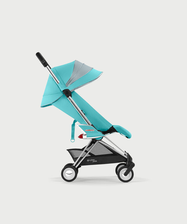 Turquoise by Jeremy Scott Wings stroller with silver accents, side view.