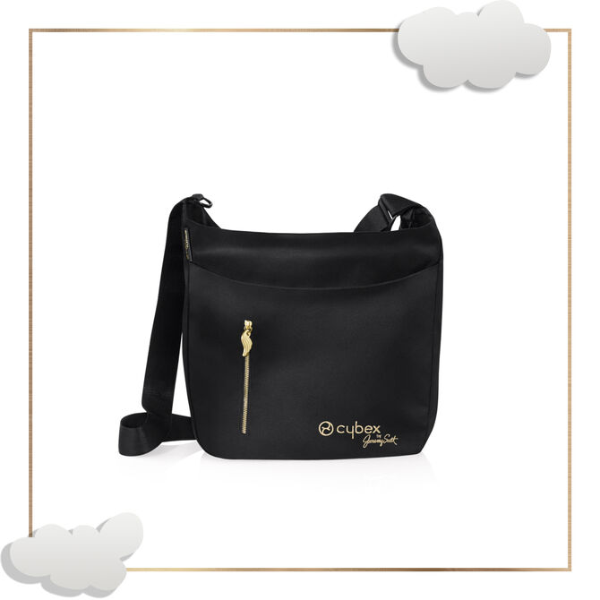 Black shoulder bag with gold accents and "Cybex by Jeremy Scott Wings" logo.