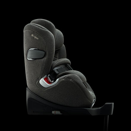 A grey Cybex car seat on a black background.