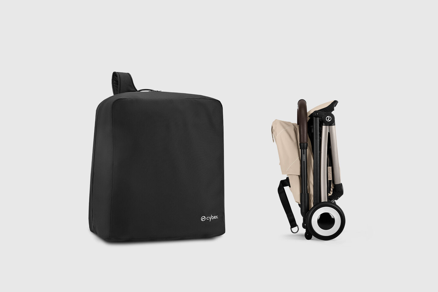 Product image of a folded Orfeo buggy with a travel bag to its left.