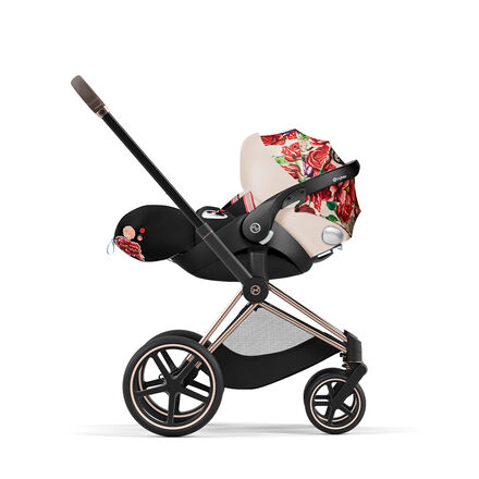 CYBEX Spring Blossom pram with floral design and black accents.