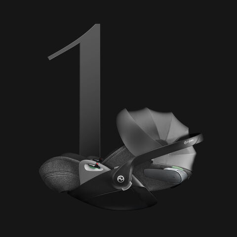 A Cybex Cloud T child car seat on a black background, next to a large number one