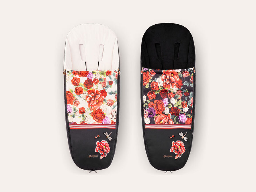 CYBEX Spring Blossom footmuffs featuring floral patterns, one in white and the other in black.