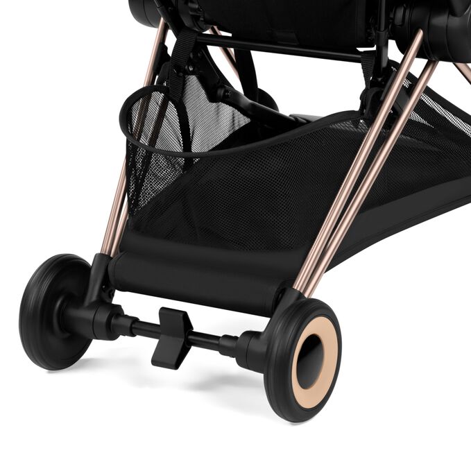 An image of the CYBEX Platinum Coya with Cot Stroller, highlighting the Large Color-matching Shopping Basket feature.