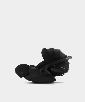 La Parisienne, a black infant car seat with an adjustable sun canopy, on a white background.