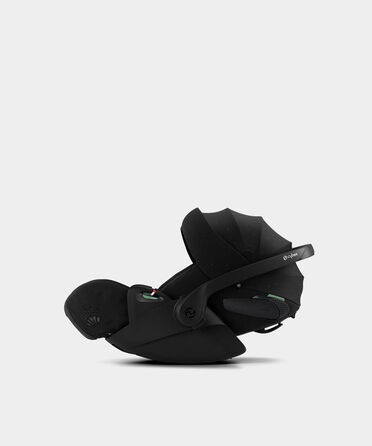 La Parisienne, a black infant car seat with an adjustable sun canopy, on a white background.