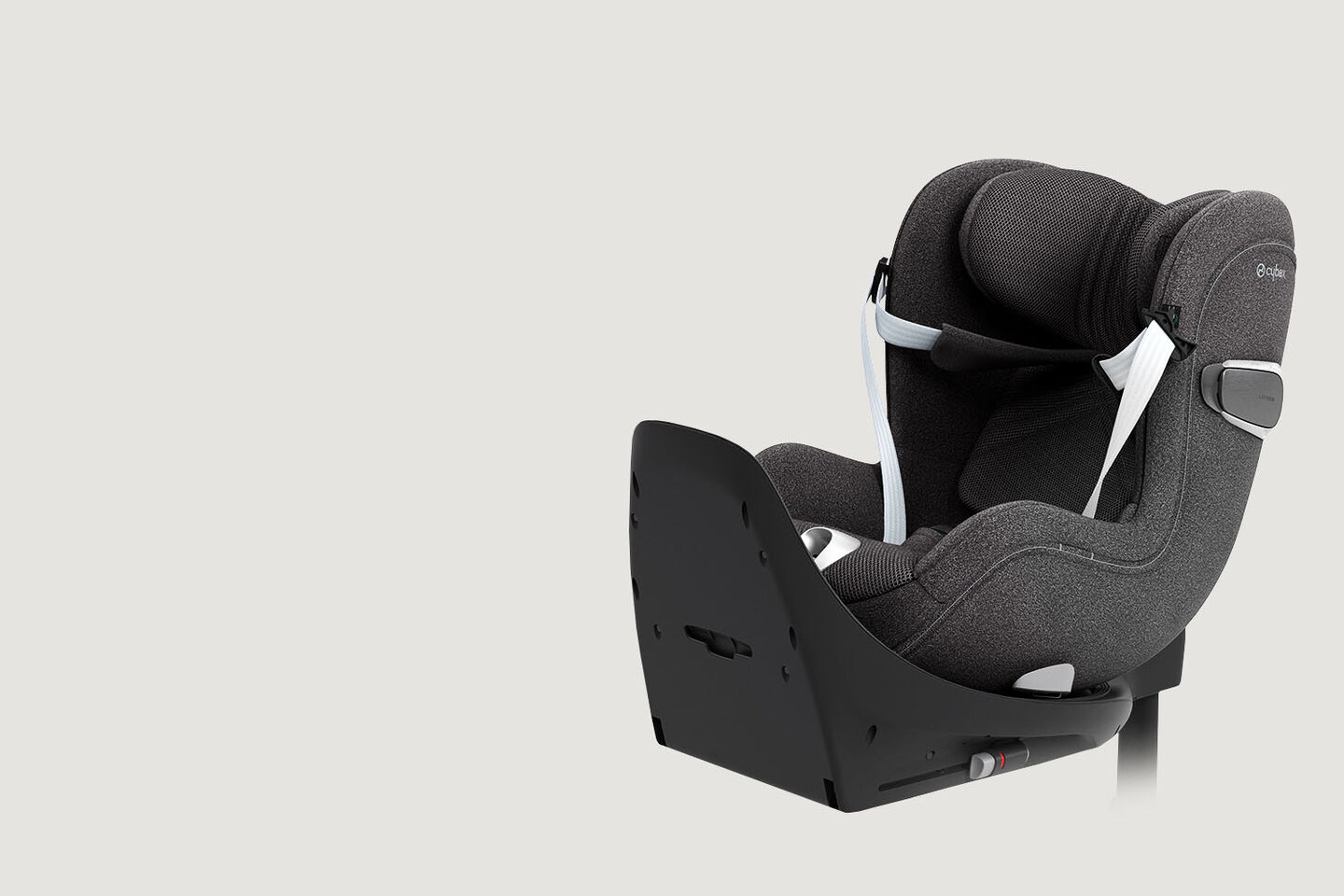 Sirona T rear-facing car seat in black with belt, side view.