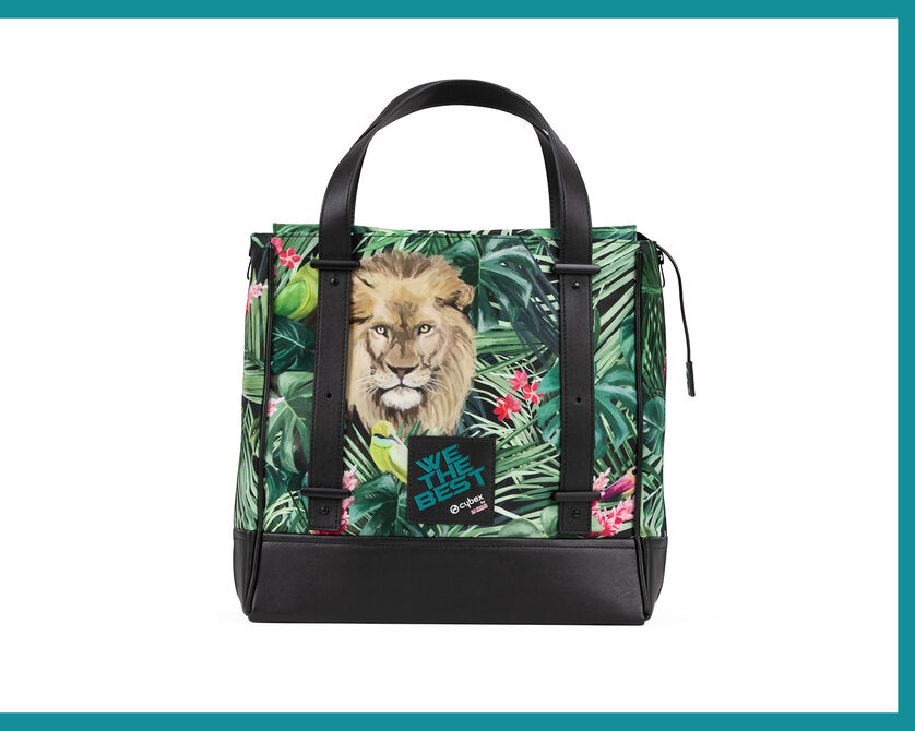 A colourful bag featuring a lion motif and tropical leaves, designed by DJ Khaled.