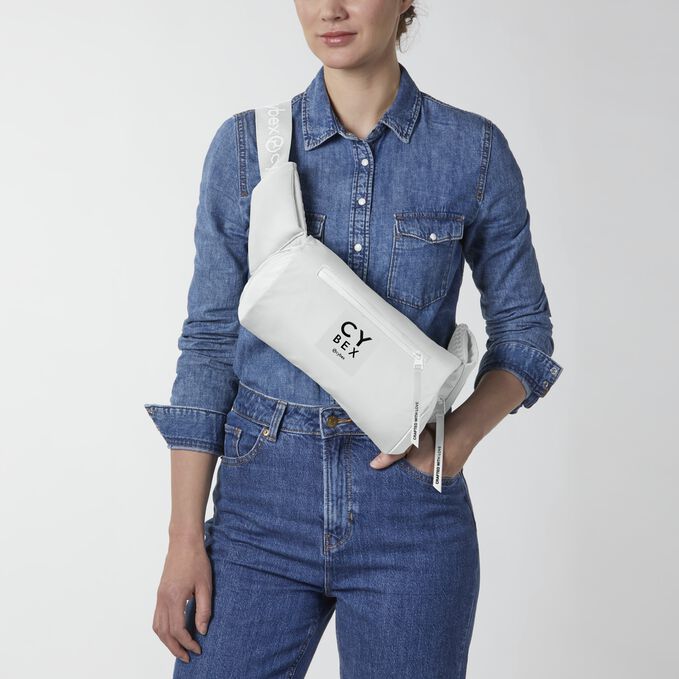 An image of the CYBEX Platinum Coya Carrier Baby Carrier, highlighting the Trendy Crossbody Bag feature.