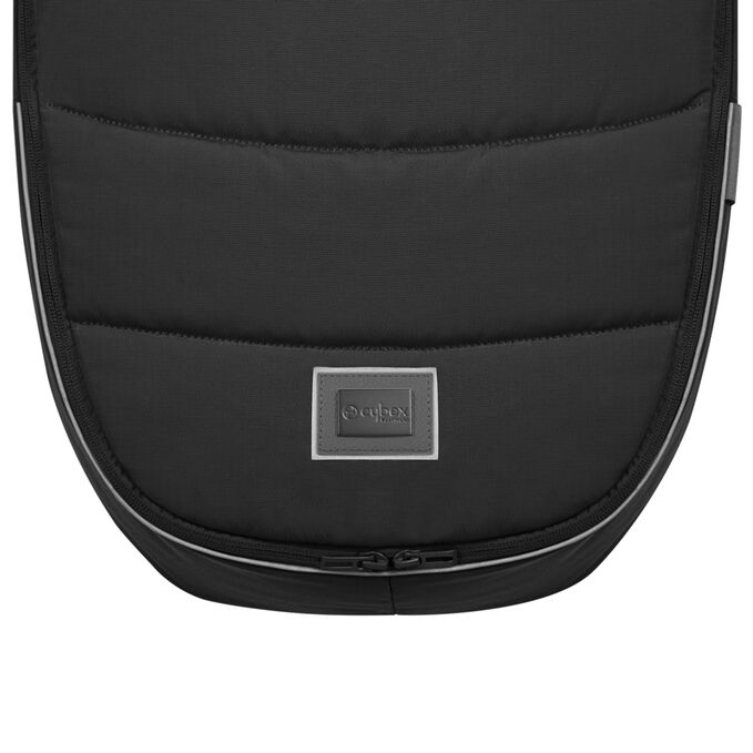 An image of the CYBEX Platinum Platinum Footmuff Accessories for Strollers, highlighting the Reflective Piping feature.