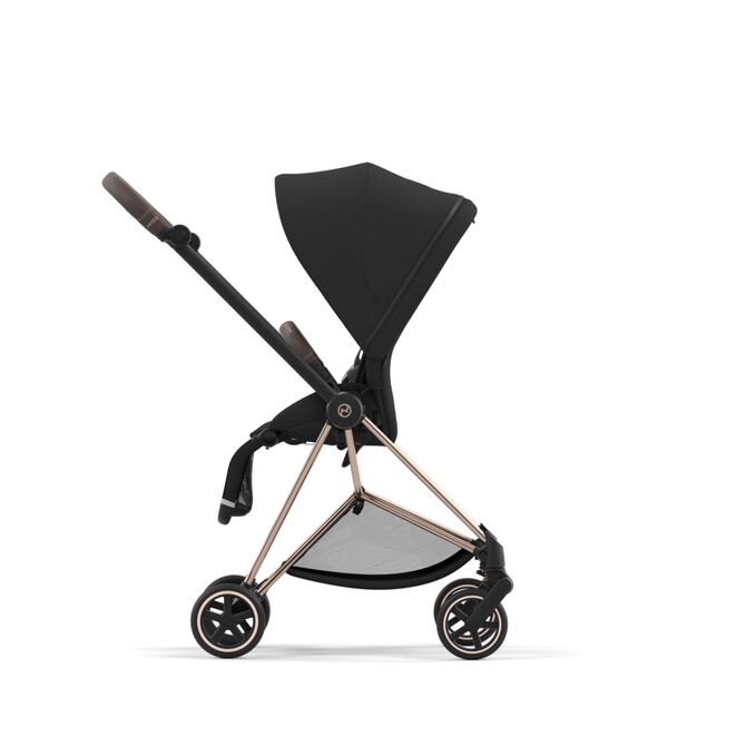 An image of the CYBEX Platinum Mios Jeremy Scott - Car Stroller, highlighting the Reversible Seat Unit feature.