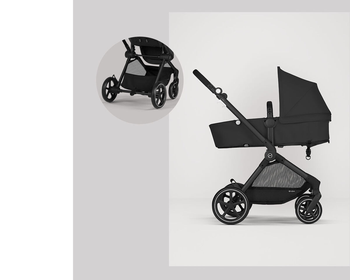 Black Eos Lux 2 in 1 stroller, side view with focus on the wheels.