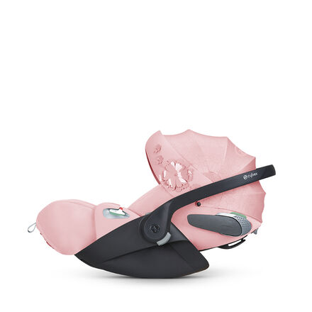 CYBEX Simply Flowers bilbarnstol i rosa med blommigt m&ouml;nster.