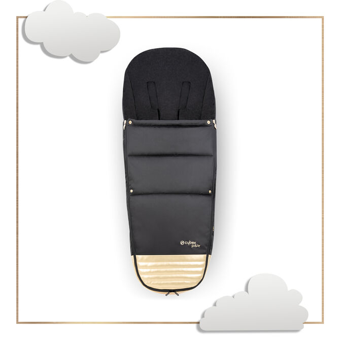 by Jeremy Scott Wings footmuff in black with gold accents, surrounded by cloud illustrations.