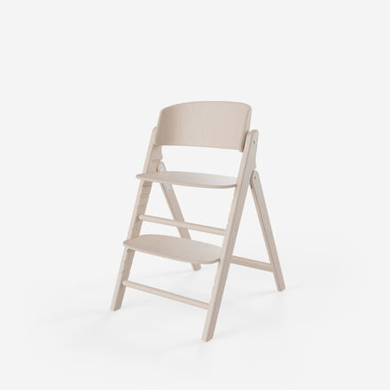 Click and Fold high chair made of light wood with adjustable seat and footrest.