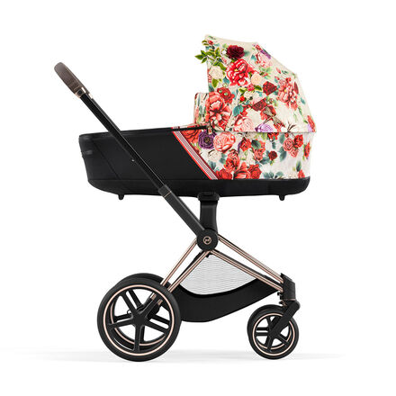 Kinderwagen Mios 3 in 1 mit floralem Muster, Seitenansicht.