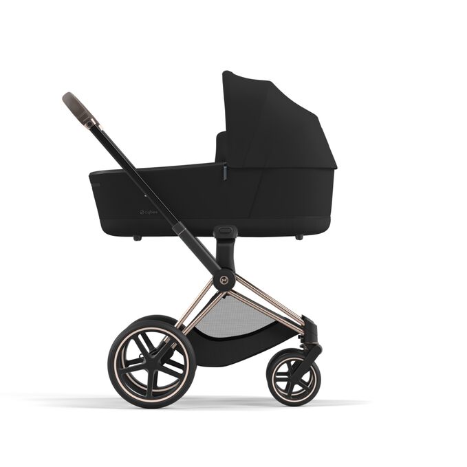 An image of the CYBEX Platinum Priam Lux Carry Cot Stroller, highlighting the Closer contact feature.