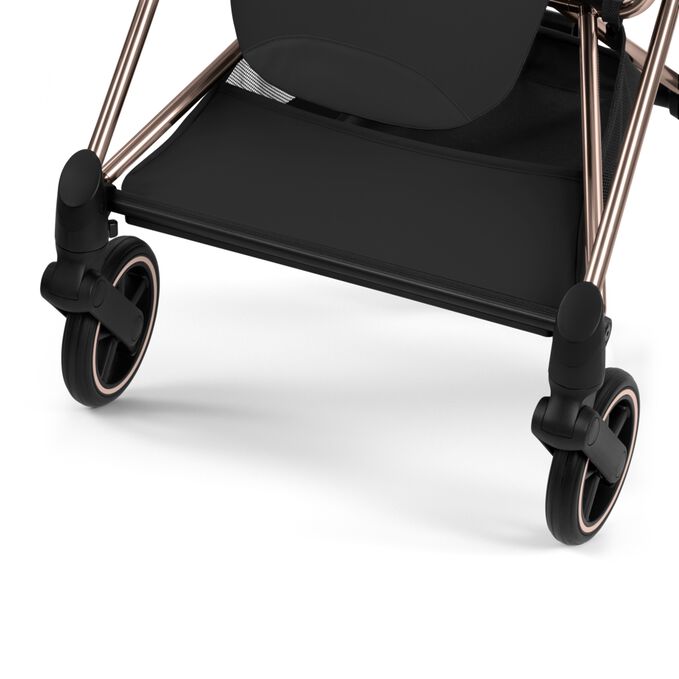 An image of the CYBEX Platinum Mios Rebellious Luxury Stroller, highlighting the Large Color-matching Shopping Basket feature.