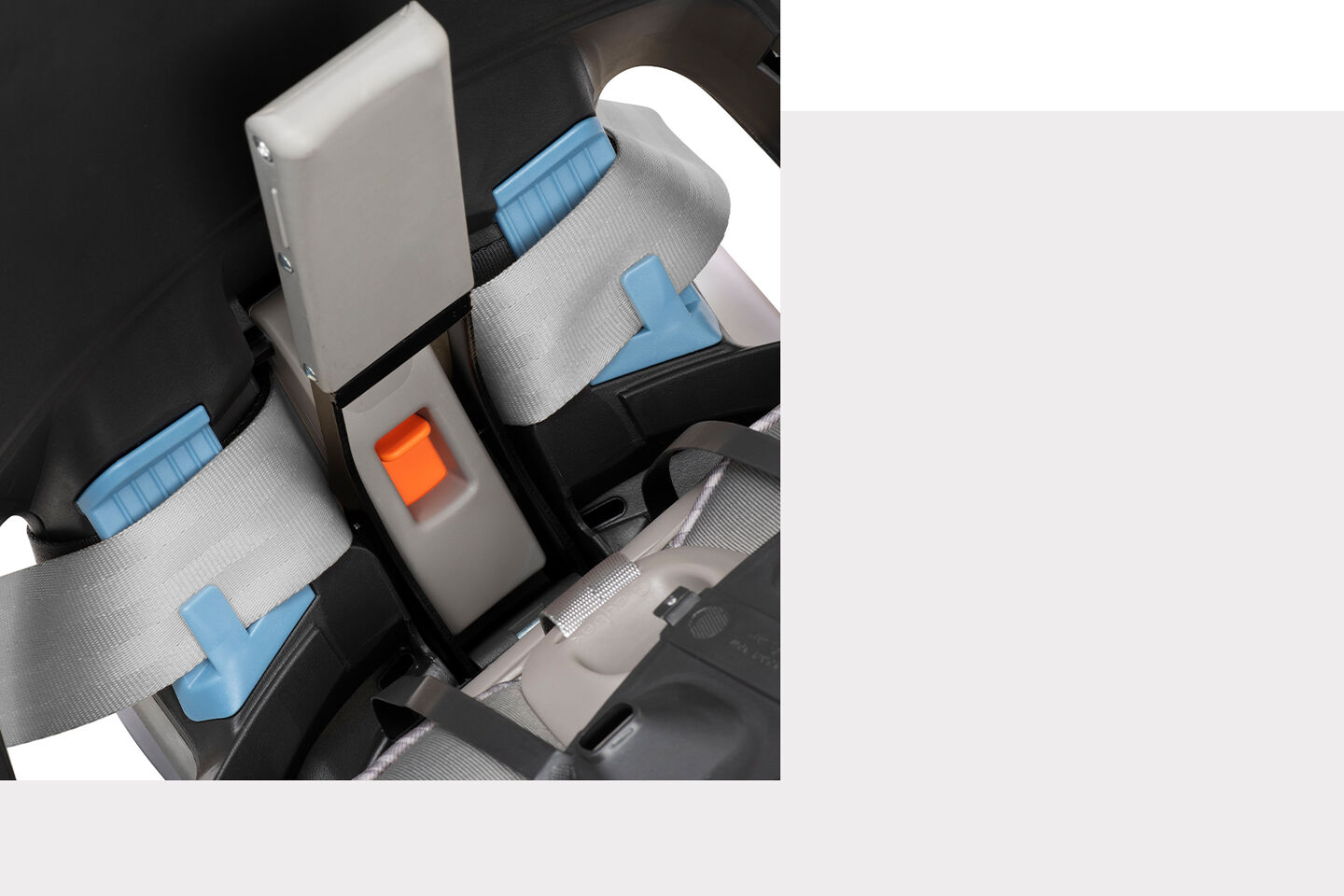The interior of a Sirona S car seat featuring grey safety straps and blue and orange details.