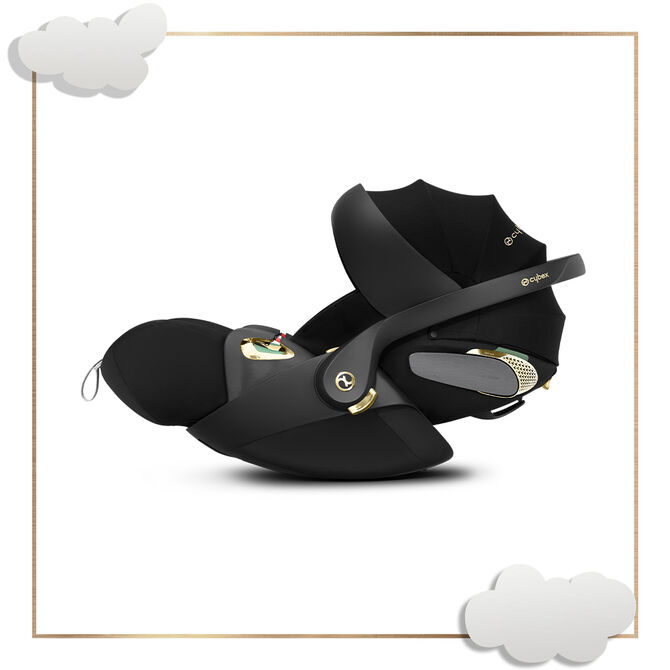 by Jeremy Scott Wings car seat in black with gold accents, side view.