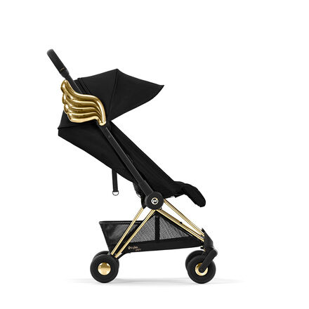 Black stroller by Jeremy Scott Wings with gold wings on the side.