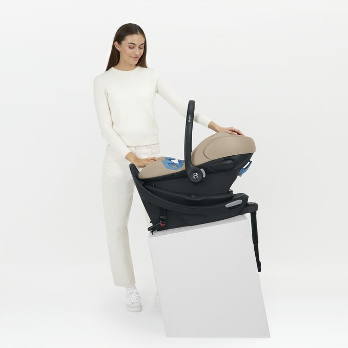 An image of the CYBEX Gold Aton G2 Swivel with Load Leg Base Infant Car Seat, highlighting the Anti-Rebound Base with Load Leg feature.