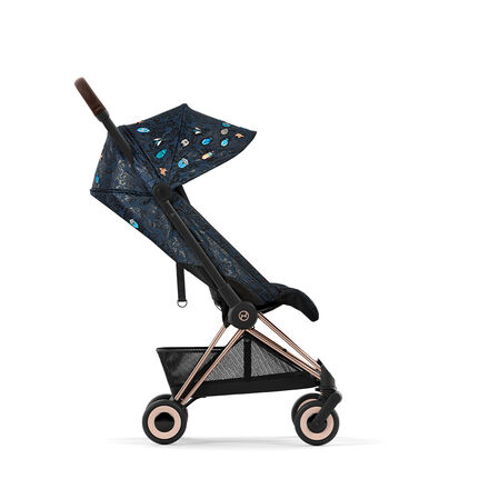 Pushchair with elegant dark blue pattern and gold accents, side view.