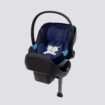 A dark blue infant car seat with a black base and adjustable carrying handle.