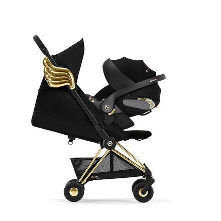 by Jeremy Scott Wings pram in black with golden wings on the side.