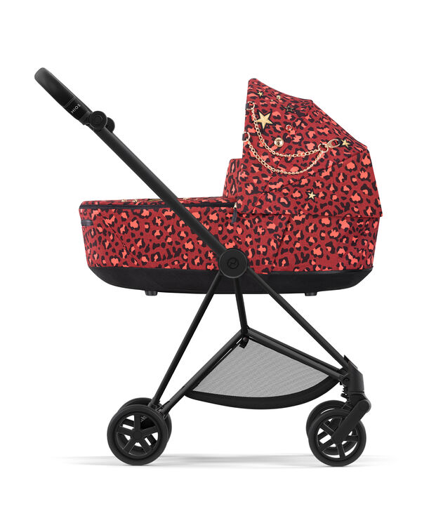 CYBEX Rockstar Kinderwagen mit rotem Leopardenmuster und goldenen Verzierungen.