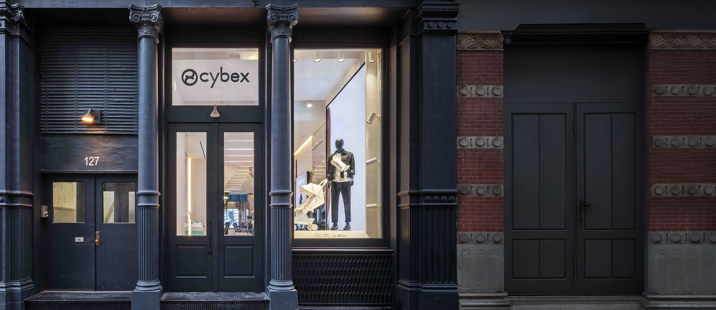 CYBEX Flagship Store New York with a mannequin and a Coya Urban Mobility lightweight pushchair in the window.