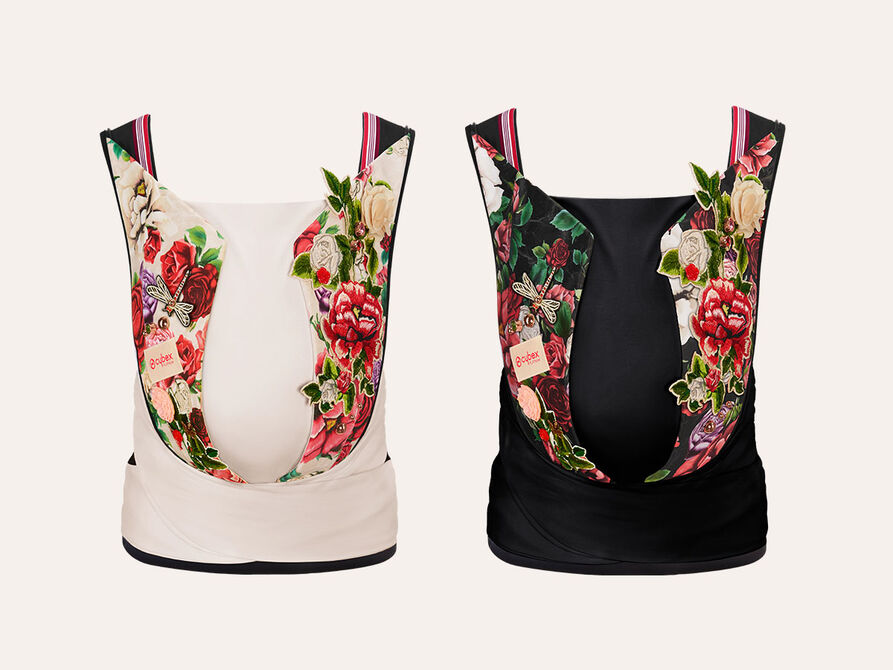 CYBEX Spring Blossom baby carrier in white and black with floral patterns.