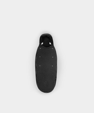 La Parisienne footmuff in black with decorative pattern on a white background.