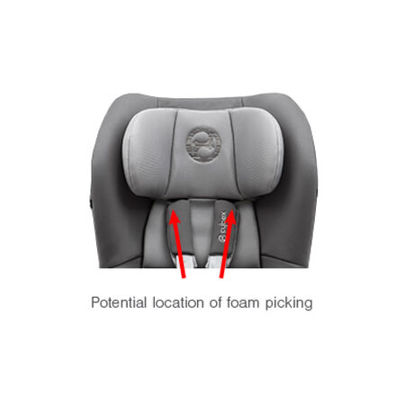 Child car seat with grey fabric, two red arrows indicating potential foam picking locations.