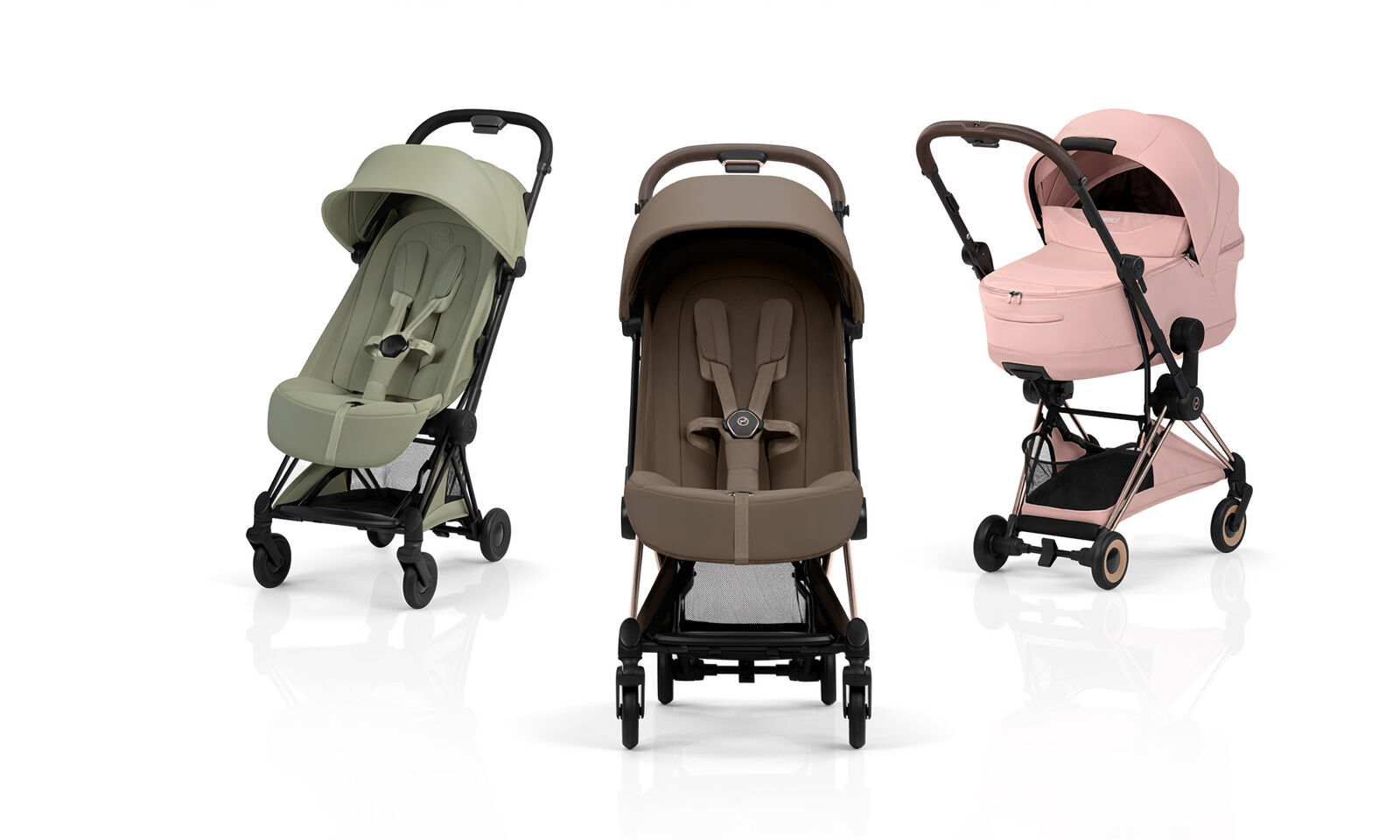 Three Co&yuml;a Style buggies in different colors, two with a seat pack, one with a cot.