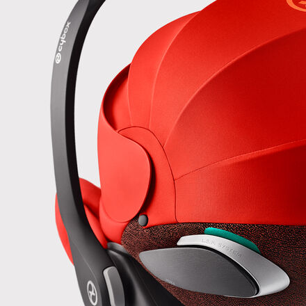 Close-up of the red Cloud Z2 infant car seat with ergonomic canopy and side-impact L.S.P. system for enhanced safety