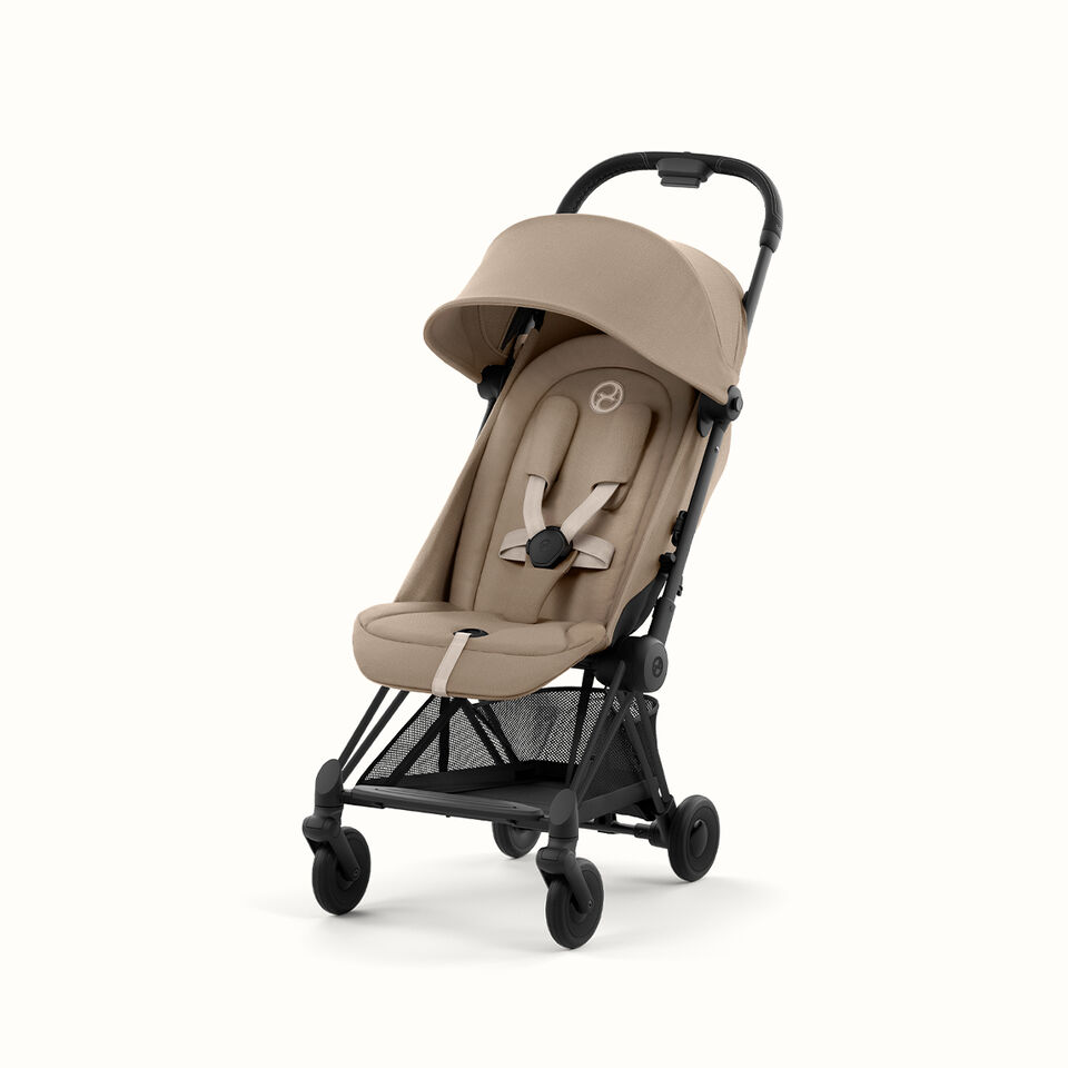Compact stroller in beige with an adjustable sun canopy and a comfortable seat