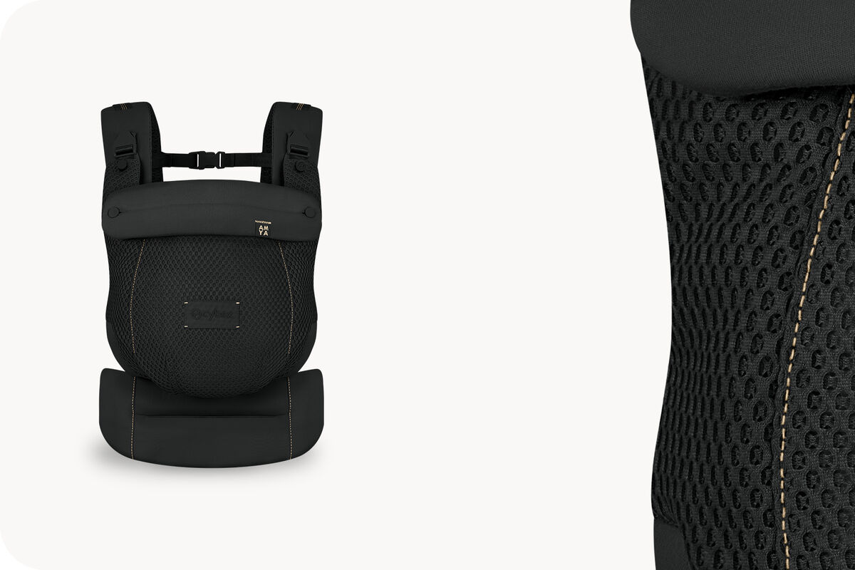 Two product images of an Amya baby carrier in Magic Black.
