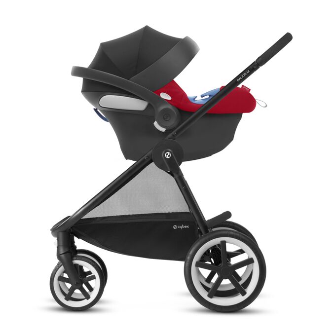 An image of the CYBEX Silver Aton B i-Size Infant Car Seat, highlighting the Continue your journey outside the car feature.