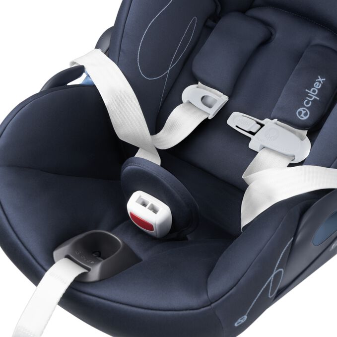 An image of the CYBEX Gold Aton G with Base Infant Car Seat, highlighting the Easy-In Buckle Pad feature.