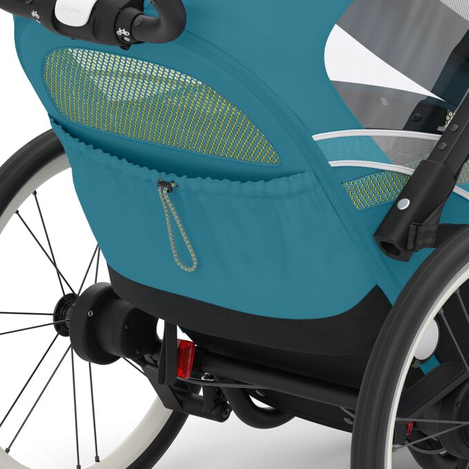Ein Bild des CYBEX Gold Zeno Bike Bike Trailer, das das Merkmal Praktischer Stauraum hervorhebt.
