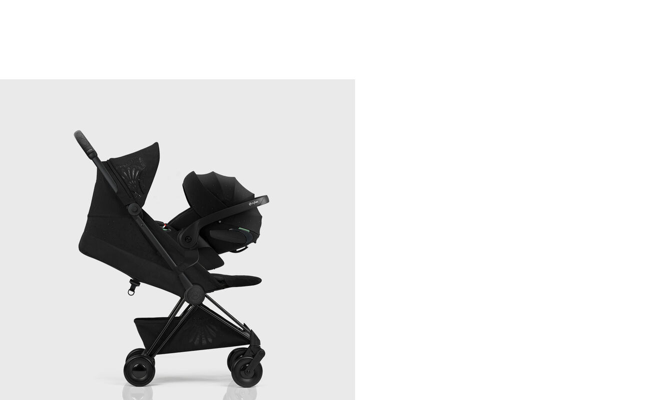 Black La Parisienne pushchair, side view.