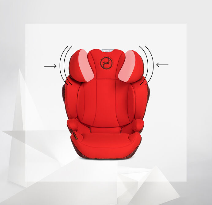Red Solution Z booster car seat with side protection pads on a grey background.