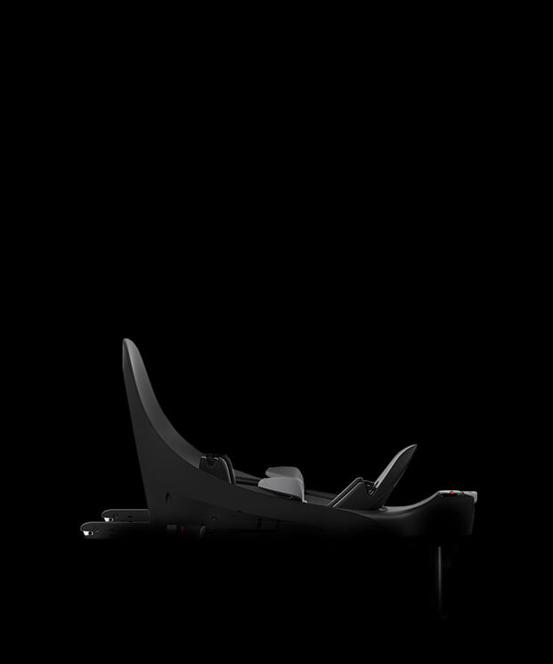 A black car seat adapter on a black background.