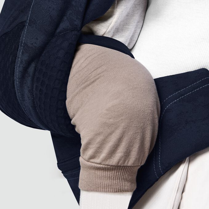 An image of the CYBEX Platinum Coya Carrier Rebellious Luxury Baby Carrier, highlighting the All-around Safety feature.