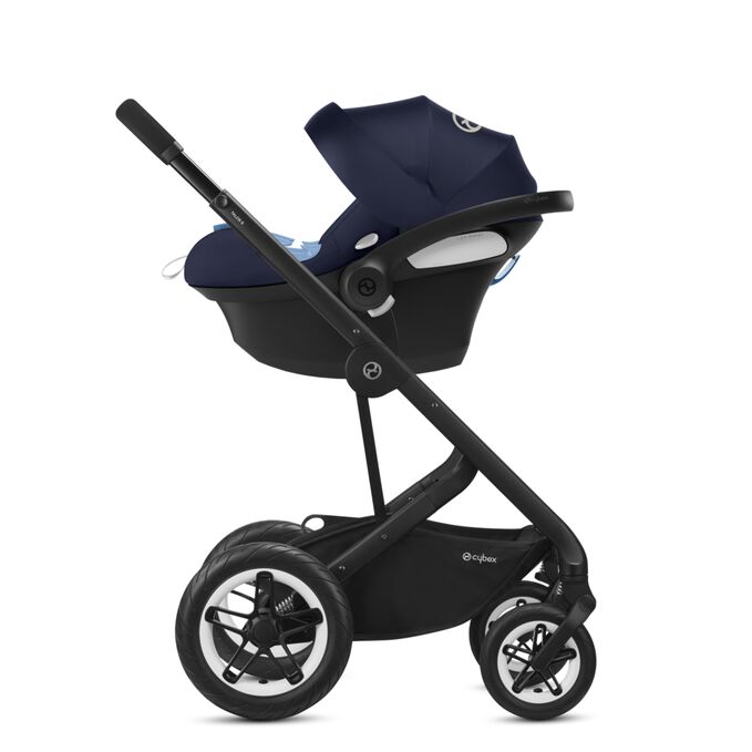 An image of the CYBEX Gold Aton M Infant Car Seat, highlighting the Travel System feature.