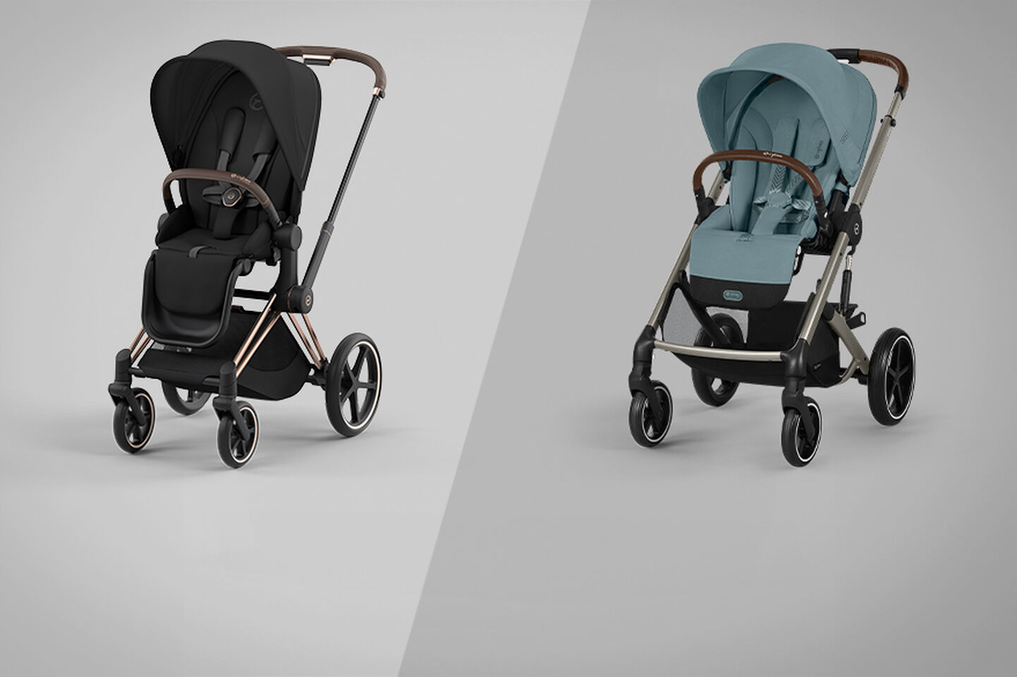 Two modern prams, one in black with copper accents and the other in light blue with silver accents, side by side on a grey background.